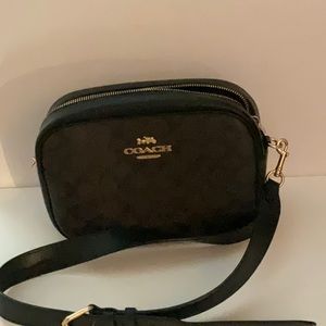 Coach crossbody. Signature brown and black with gold accents.